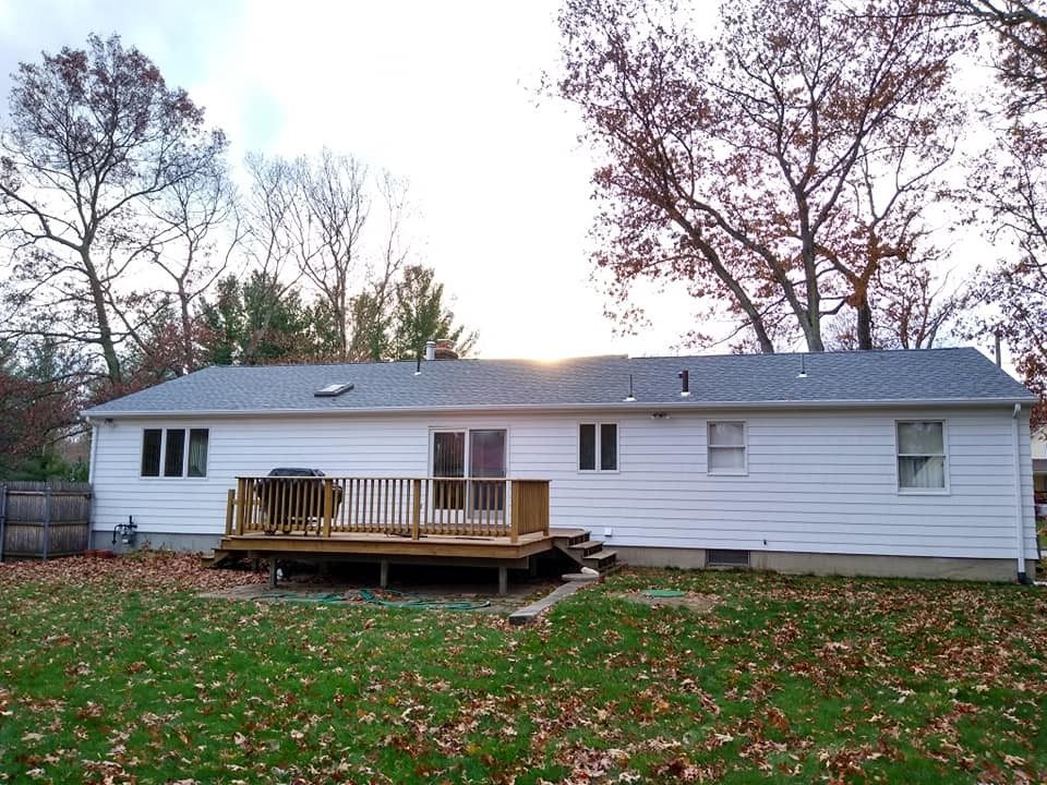 Deck painting in RI: back deck on a ranch home, a Genesis Painting job