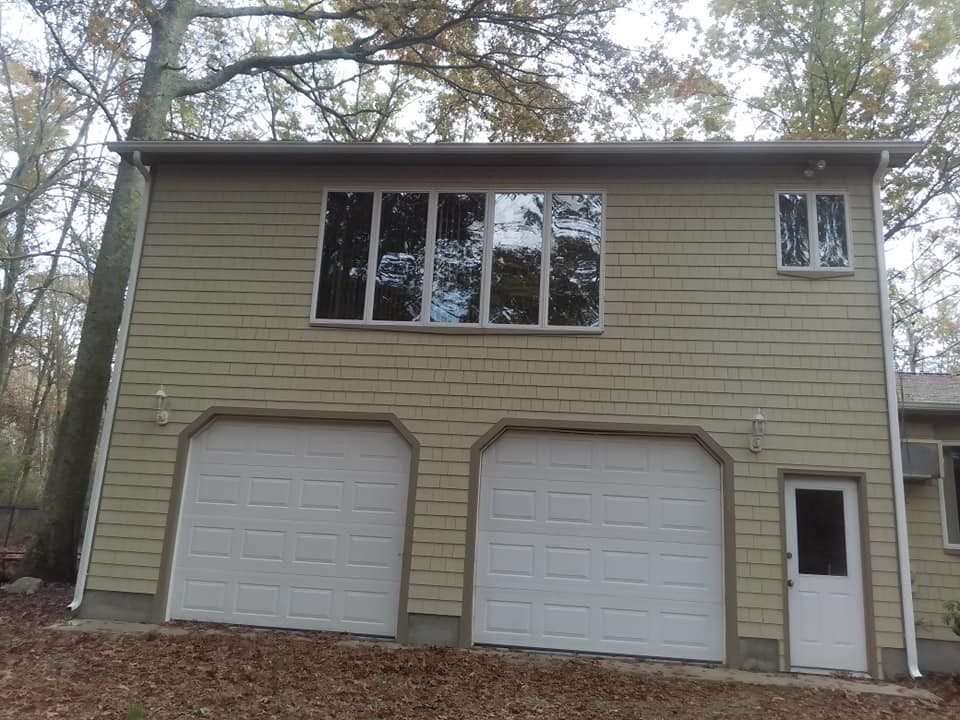 Exterior repaint, two-car garage, a Genesis Painting job